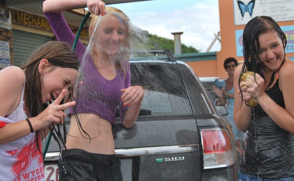 Tayla Solly, Lauren Werner and Keeley Kerr having fun at the car wash.